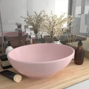 Chiuvetă de lux, roz mat, 40 x 33 cm, ceramică, formă ovală - Acestă chiuvetă de formă ovală, realizată din ceramică premium, este un plus elegant pentru orice baie, toaletă sau budoar. Suprafața sa mată și desig...