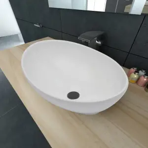 Chiuvetă ovală, alb, 40 x 33 cm, ceramică premium - Această chiuvetă de baie ovală, realizată din ceramică premium, va deveni un element de decor elegant în orice baie, toaletă sau budoar. Finisajul său...