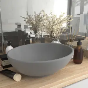 Chiuvetă lux, gri deschis mat, 40x33 cm, ceramică, formă ovală - Acestă chiuvetă de formă ovală, realizată din ceramică premium, este un plus elegant pentru orice baie, toaletă sau budoar. Suprafața sa mată și desig...